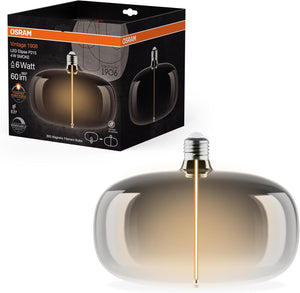 OSRAM Vintage 1906 Big Elipse è una lampada LED dimmerabile con filamento a forma di ellisse. Offre 4 W per 60 lm, attacco E27, design fumé, diametro 215 mm, resa cromatica CRI 80, 1800 K.